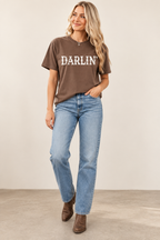 Woman wearing the Darlin' Western graphic tee in Espresso